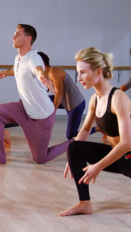 Group-of-people-performing-stretching-exercise