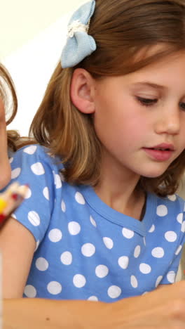 Happy-parents-and-daughter-colouring-together