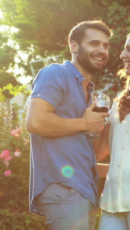 Happy-couple-drinking-red-wine