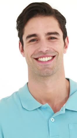 Smiling-man-playing-with-badminton-racket-and-showing-thumb-up