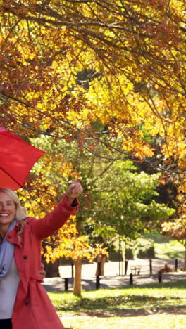 couple-outdoors-with-umbrella