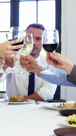 Business-people-toasting-and-having-lunch