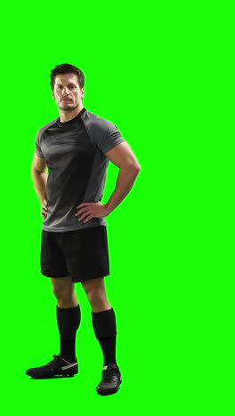 Serious-rugby-player-gesturing-in-front-of-camera-