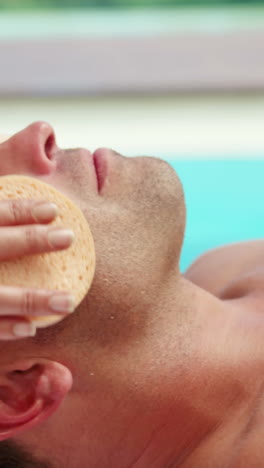 Handsome-man-having-face-treatment