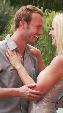 Happy-couple-hugging-nearby-pool