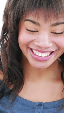 Smiling-woman-reading-a-paper-