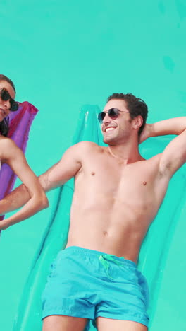 Relaxed-couple-with-sunglasses-on-lilo