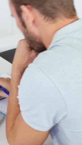 Upset-man-doing-his-accounting-with-a-laptop