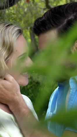 Portrait-of-a-cute-couple-embracing-and-smiling