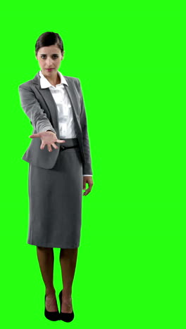 Businesswoman-gesturing-against-green-screen