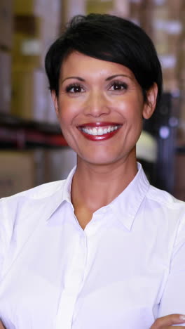 Warehouse-manager-smiling-at-camera