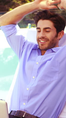 Handsome-man-using-laptop-and-relaxing