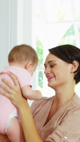 Cute-mother-playing-and-embracing-her-baby-