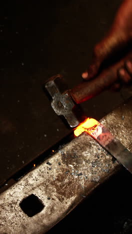 Blacksmith-working-on-a-iron-rod