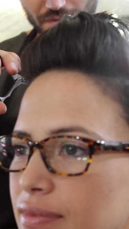 Female-getting-her-hair-trimmed