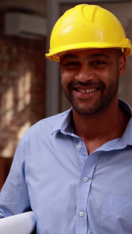 Casual-architect-walking-and-smiling-at-camera