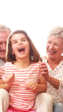 Happy-family-sitting-on-the-couch