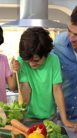 Cute-family-preparing-a-salad