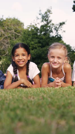 Group-of-children-lying-on-grass