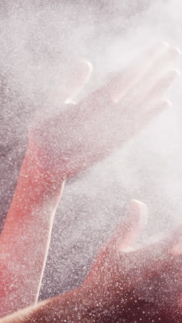 Woman-dusting-his-hands-with-chalk-powder