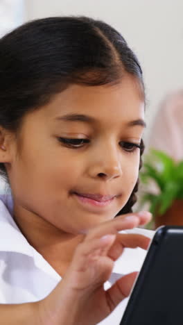 School-kids-using-digital-tablet-in-classroom