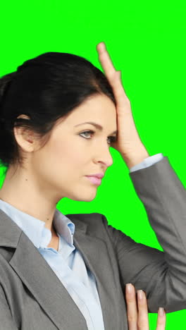 Worried-businesswoman-holding-her-head