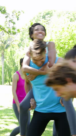 Fit-group-of-friends-having-fun-and-messing-in-the-park