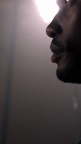 Close-up-of-sportsman-holding-basketball