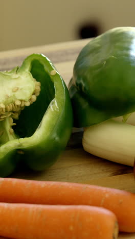 Fresh-vegetables-kept-on-the-chopping-board-in-kitchen