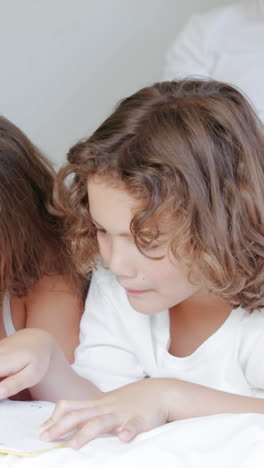 Children-reading-while-parents-talking