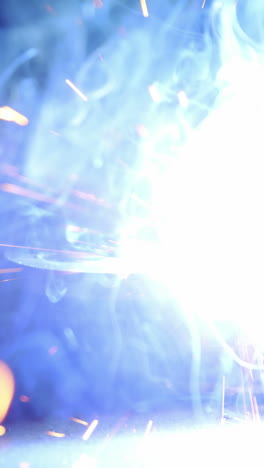 Close-up-of-welder-working-on-a-piece-of-metal