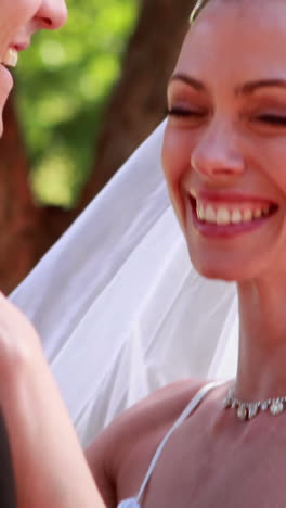 Young-newlyweds-dancing-together-and-smiling-at-camera