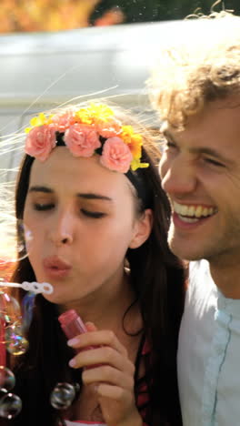 A-group-of-hipster-friends-doing-soap-bubbles