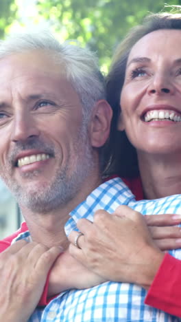 Mature-couple-is-relaxing-and-embracing-in-the-street