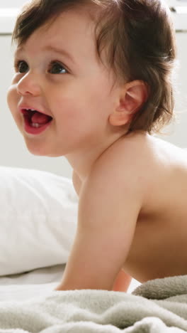 Cute-baby-playing-on-a-bed-