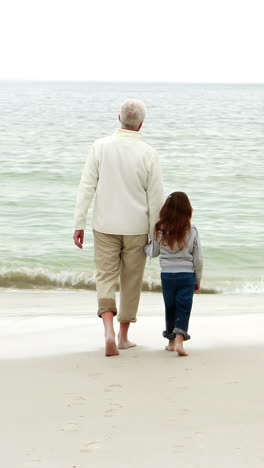 Grandfather-and-granddaughter-walking-together