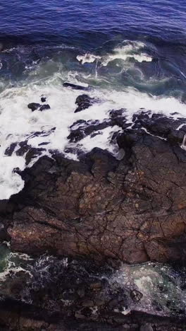 Aerial-view-of-waves-reaching-a-shore-at-beach