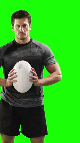 Serious-rugby-player-with-ball-