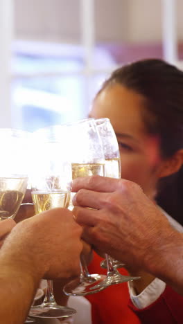 Business-executives-toasting-glasses-of-champagne