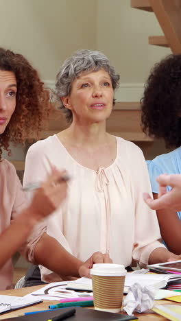 Concentrated-women-talking-during-a-meeting