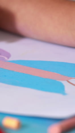 Preschool-class-drawing-at-table-in-classroom