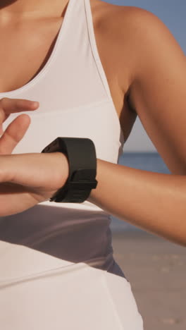 Close-up-of-a-woman-is-using-her-connected-watch-