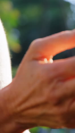 Mature-woman-checking-plant