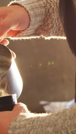 Waiter-making-cup-of-coffee-in-cafe