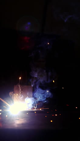 Welder-working-on-a-piece-of-metal