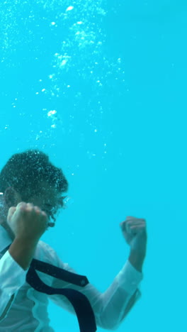 Businessman-diving-into-water