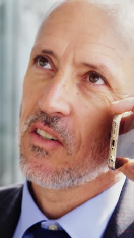 Businessman-talking-on-mobile-phone