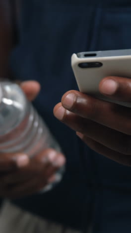 Man-using-mobile-phone-at-home