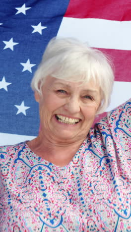 Senior-couple-holding-american-flag