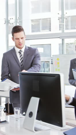 Businesswomen-interacting-with-each-other-while-walking